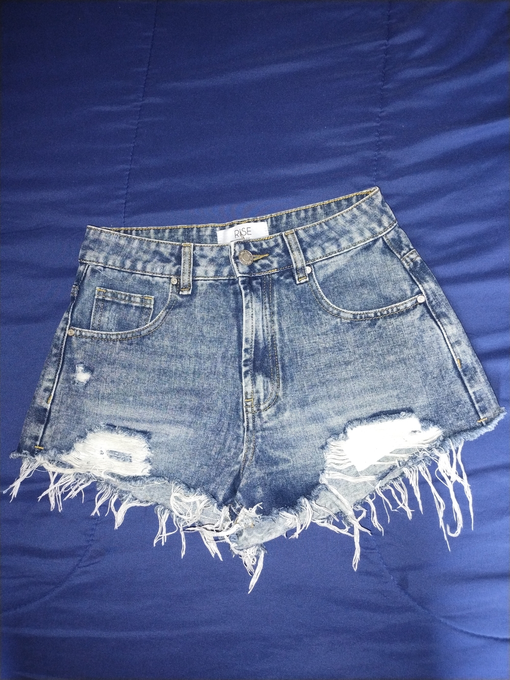 Rise High-Rise Distressed Denim Shorts in Medium Blue